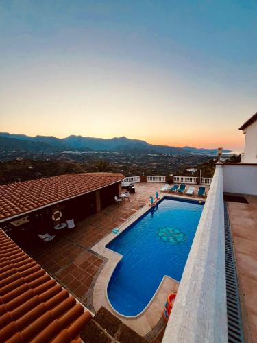 a swimming pool on the roof of a building at Natura Escapade in Torrox