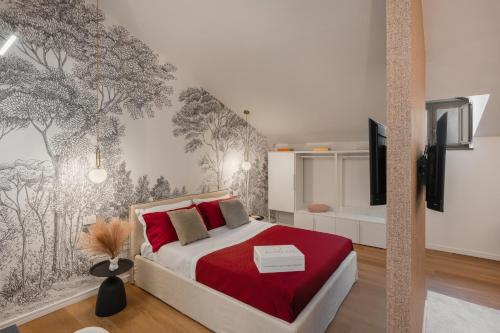 a bedroom with a bed and a wall with trees at Altrove Boutique Studios in Caserta
