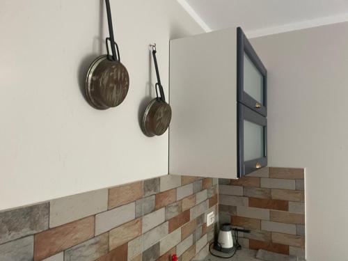 a kitchen with two pots and a cabinet at Suite4Rent Iași in Iaşi