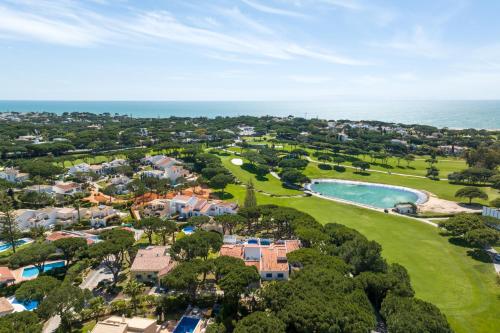 an aerial view of a resort with a golf course at Vale Do Lobo Resort in Vale do Lobo