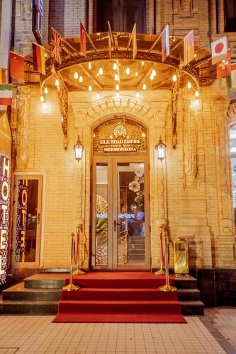 a front door of a building with a red carpet at Silk Road Empire in Samarkand