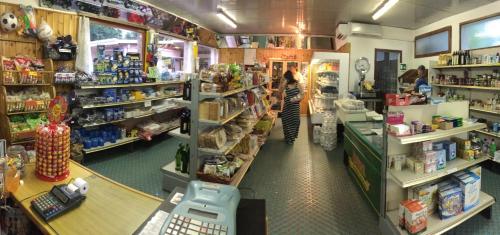 a woman standing in a grocery store aisle at Camping Serenissima in Malcontenta