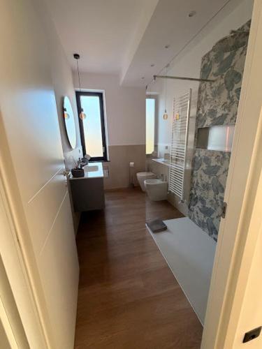 a bathroom with a toilet and a sink at Oasi di Comago in Sant'Olcese