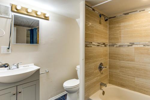 a bathroom with a sink and a toilet and a shower at Train to Philly! Pet-Friendly Unit in Barrington in Barrington