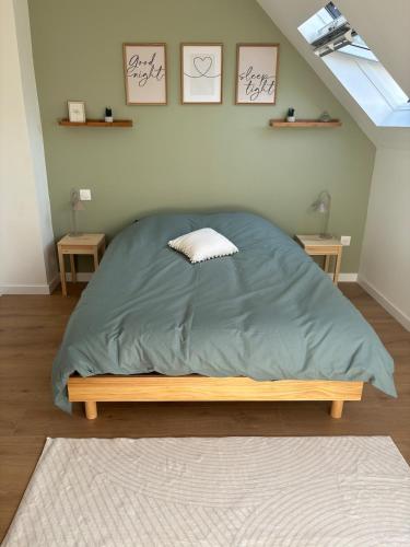 a bedroom with a bed with a pillow on it at La Bohème d'Opale in Boulogne-sur-Mer