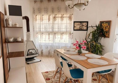a dining room with a table and chairs at The Old Corner House in Velingrad