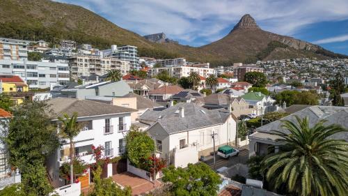 a city with houses and mountains in the background at Villa Costa Rose in Cape Town