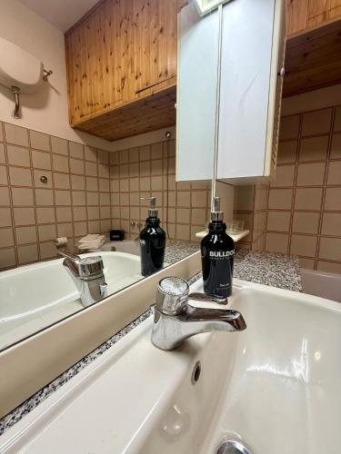 a bathroom with a sink and a mirror at Rome Home Cinecittà in Rome