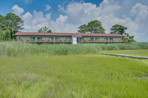 a building in the middle of a field at Assateague Inn 100-2R in Chincoteague