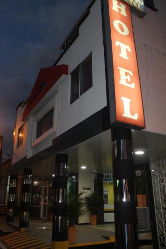 a hotel sign in front of a building at Ayenda Castillo Real 1521 in Bucaramanga