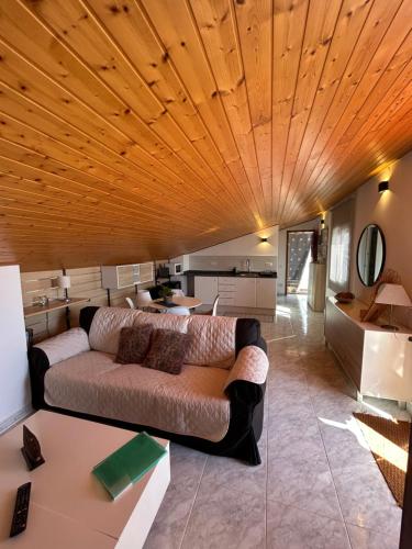 a living room with a couch and a table at Apartament Villa Luisa in Can Trabal