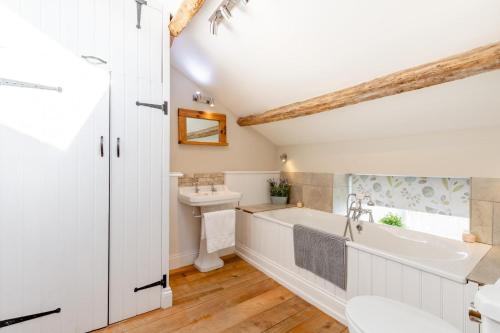 a bathroom with a tub and a sink at 2 Bed in Penrith oc-87349 in Penrith
