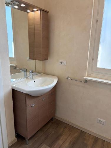 a bathroom with a sink and a mirror at Ca' Sonenga in Menaggio