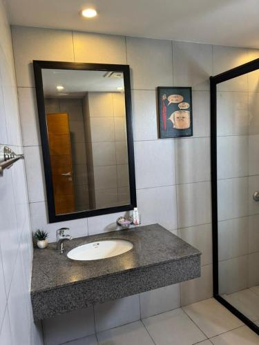 a bathroom with a sink and a mirror at Executive 2 bedrooms in Rawalpindi - Self Checkin in Rawalpindi