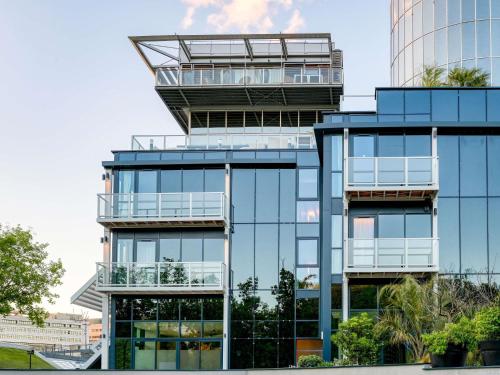 an office building with a glass facade at Novotel Paris Centre Bercy in Paris
