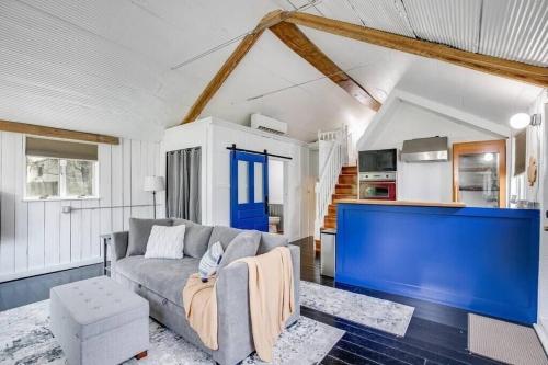 a living room with a couch and a kitchen at Cozy Bungalow 7 Blocks from ND Campus in South Bend