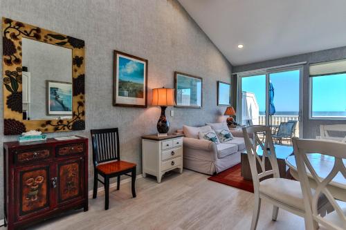 a living room with a table and a couch at Sea Crest in Amagansett