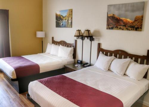 a hotel room with two beds in a room at Ohkay Hotel Casino in San Juan Pueblo