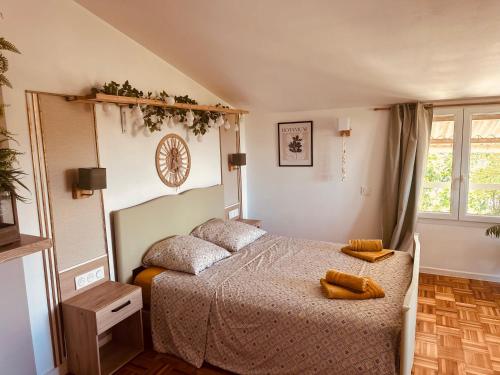a bedroom with a bed with two pillows on it at Villa Sainte Anne in Sénas