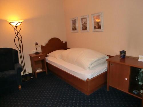 Ένα ή περισσότερα κρεβάτια σε δωμάτιο στο Hotel Brügge