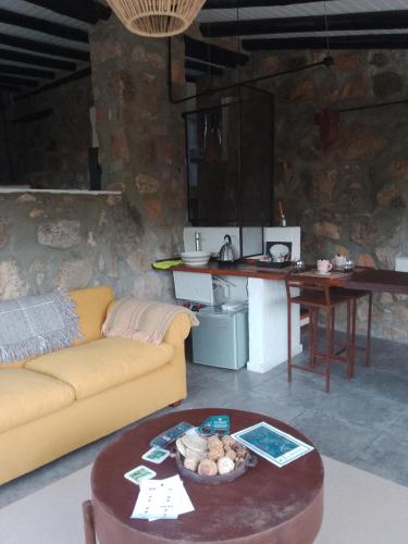 a living room with a couch and a table at Oveja Mansa in La Cumbre