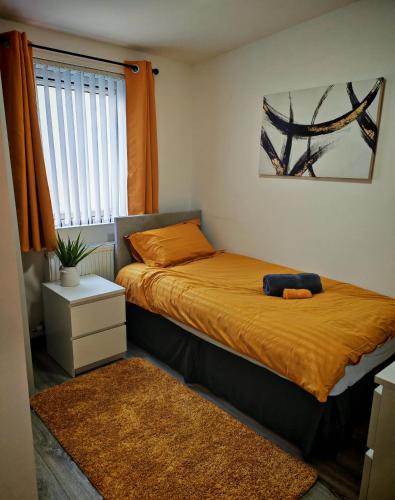a small bedroom with a bed and a window at Phoenix in Derry Londonderry