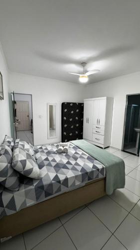 a bedroom with a large bed in a room at Ed Odilon Vieira 304 in Vitória da Conquista