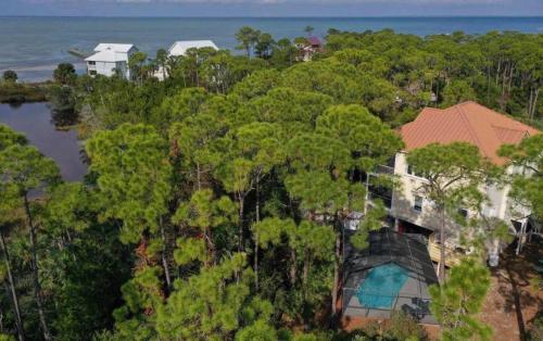 an aerial view of a house in the forest at St George Island Bay Front Pool in St. George Island
