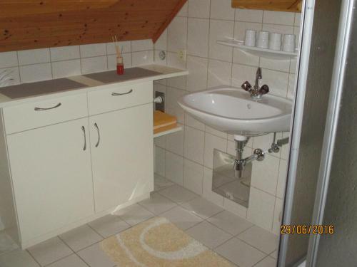a small bathroom with a sink and a counter at Ferienwohnung Steinwender in Döbriach