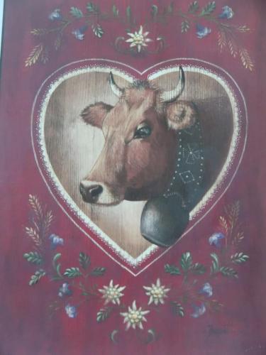 a painting of a cow on a wall at Auberge du Pont de l'Alp in Le Monêtier-les-Bains