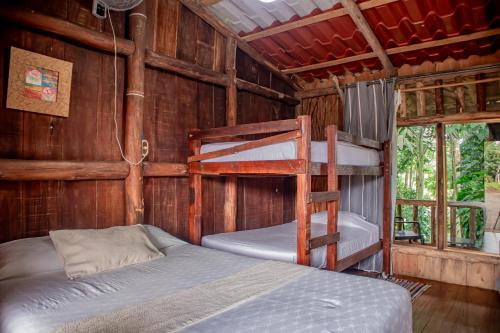 a bedroom with two bunk beds and a ladder at Hotel del Bosque in Río Cuarto