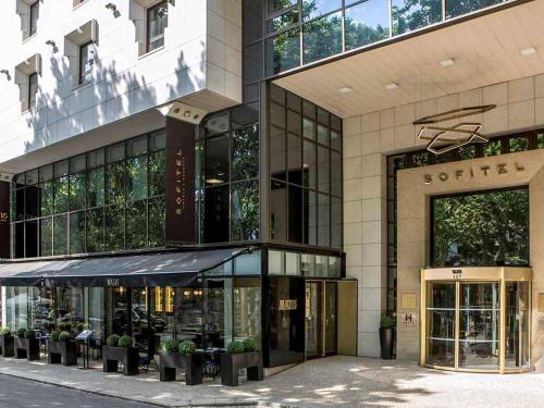 a building with a store in front of it at Sofitel Lisbon Liberdade in Lisbon