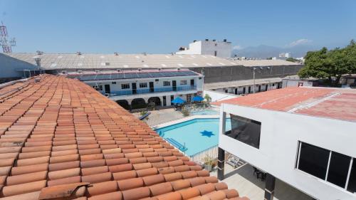 an overhead view of the roof of a building with a pool at Damar Hotel Collection Valledupar in Valledupar