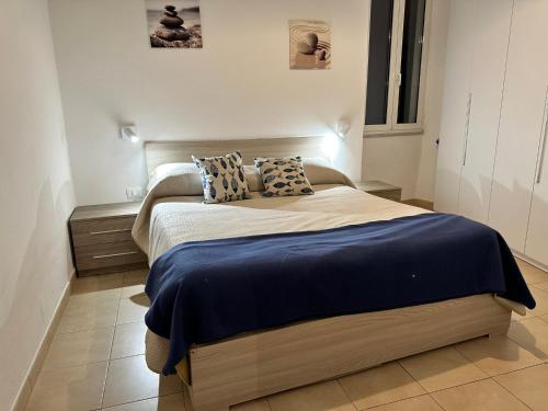 a bedroom with a bed with two pillows on it at Petriccioli seaview in Lerici