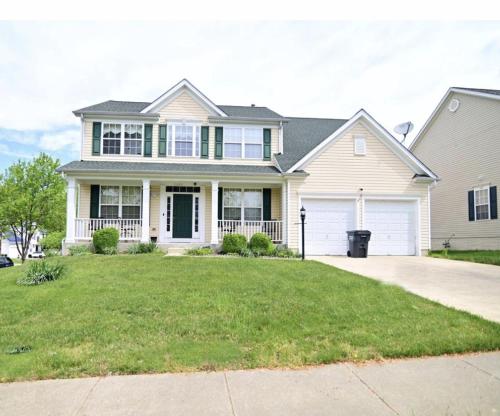 a large white house with a driveway at Sakisa International in Waldorf