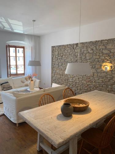 a living room with a table and a couch at Prázdninový dům Litomyšl 79 in Litomyšl