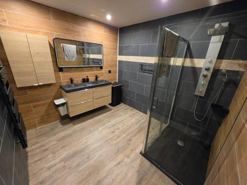 a bathroom with a sink and a shower at maison guy in Priay