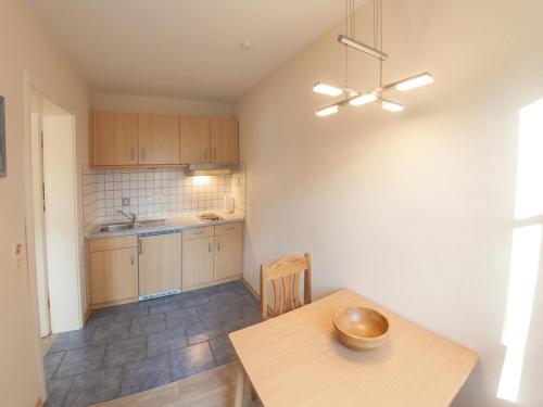 a kitchen with a wooden table with a bowl on it at Apartment Leefke im Dangaster Nest in Varel