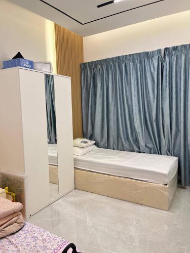 a bedroom with a bunk bed and a mirror at Relaxing bed Ajman in Ajman 
