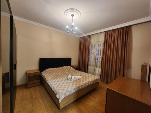 a bedroom with a bed with two candles on it at Luma home in Angisa