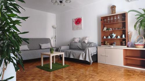 a living room with a couch and a table at Apartment Irene in Pula