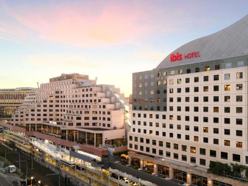 a view of two tall buildings in a city at ibis Sydney Darling Harbour in Sydney