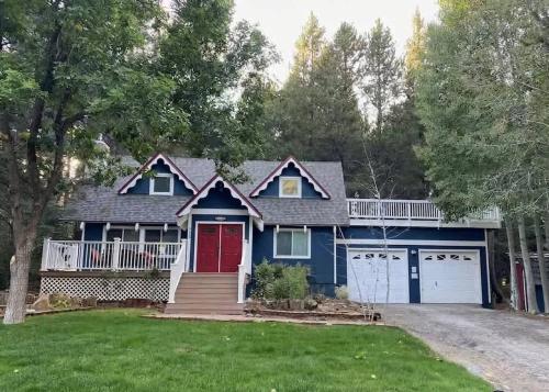 a blue house with a red door at Serenity Woods - Game Room & More in South Lake Tahoe