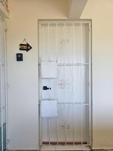 a door in a room with white walls at AZUL PUERTO Del MALECON in San Felipe de Puerto Plata