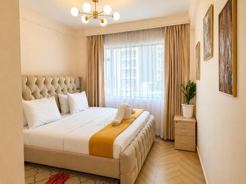 a bedroom with a large bed with a window at Desired Atmosphere Safaris in Nairobi