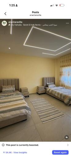 two beds sitting in a room with at مزرعة اننتارا in Amman