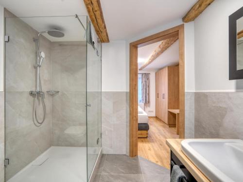 a bathroom with a shower and a sink at Chalet Bergglück in Sellrain