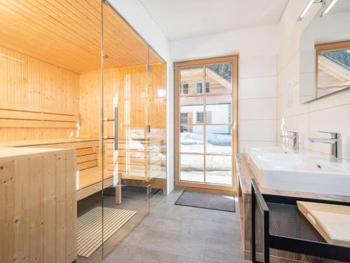 a bathroom with a sink and a window at Haus am Bach in Donnersbachwald