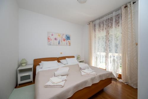 Apartments and rooms with parking space Palit, Rab - 22221