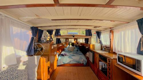 a room with a bed in the middle of a van at Shipwrecked Oasis Ocean Bay Getaway PL in Fingal